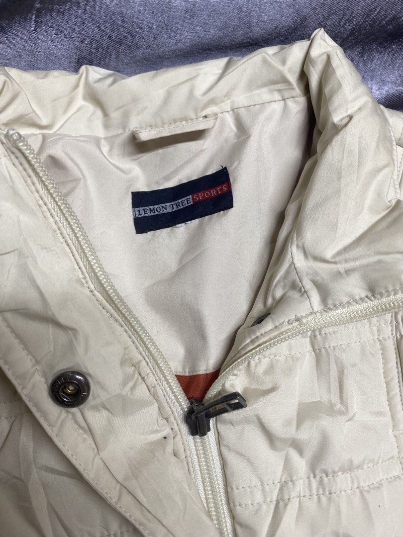 Lemon Tree Sports Quilted Jacket (Category: Coats, Jackets and Outerwear) located in Manila. Submitted by kevinthriftshop (Listing ID 1461052222, Image 2). Description: - Cream colored quilted jacket - Brand: Lemon Tree Sports - Zip-up front with button closure at the collar - Two front pockets - Lightweight and comfortable - Ideal for layering Location: Cavite.
