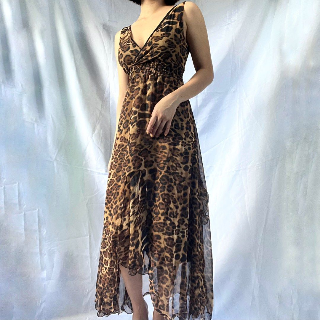 Leopard Print High-Low Maxi Dress (Category: Dresses) located in Manila. Submitted by demi.rewears (Listing ID 1461068250, Image 3). Description: Flowy leopard print maxi dress with ruched waist, V-neck, and ruffled high-low hem. Sleeveless. Perfect for nights out or special events. Fits Small to Medium Bust 31-33 Waist 23-26 Length 47.