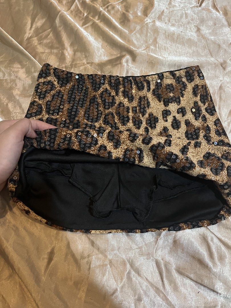 Leopard Print Sequin Mini Skirt (Category: Skirts) located in Manila. Submitted by rhian_leighhh (Listing ID 1461113392, Image 2). Description: - Fun leopard print mini skirt - Covered in shiny sequins - Built-in shorts for extra coverage - Ideal for nights out or parties - Super cute and eye-catching design.