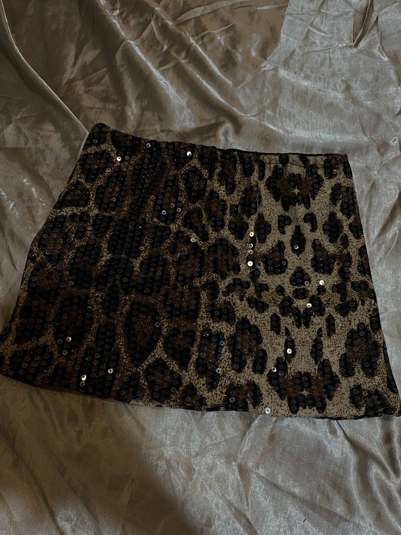 Leopard Print Sequin Mini Skirt (Category: Skirts) located in Manila. Submitted by rhian_leighhh (Listing ID 1461113392, Image 1). Description: - Fun leopard print mini skirt - Covered in shiny sequins - Built-in shorts for extra coverage - Ideal for nights out or parties - Super cute and eye-catching design.