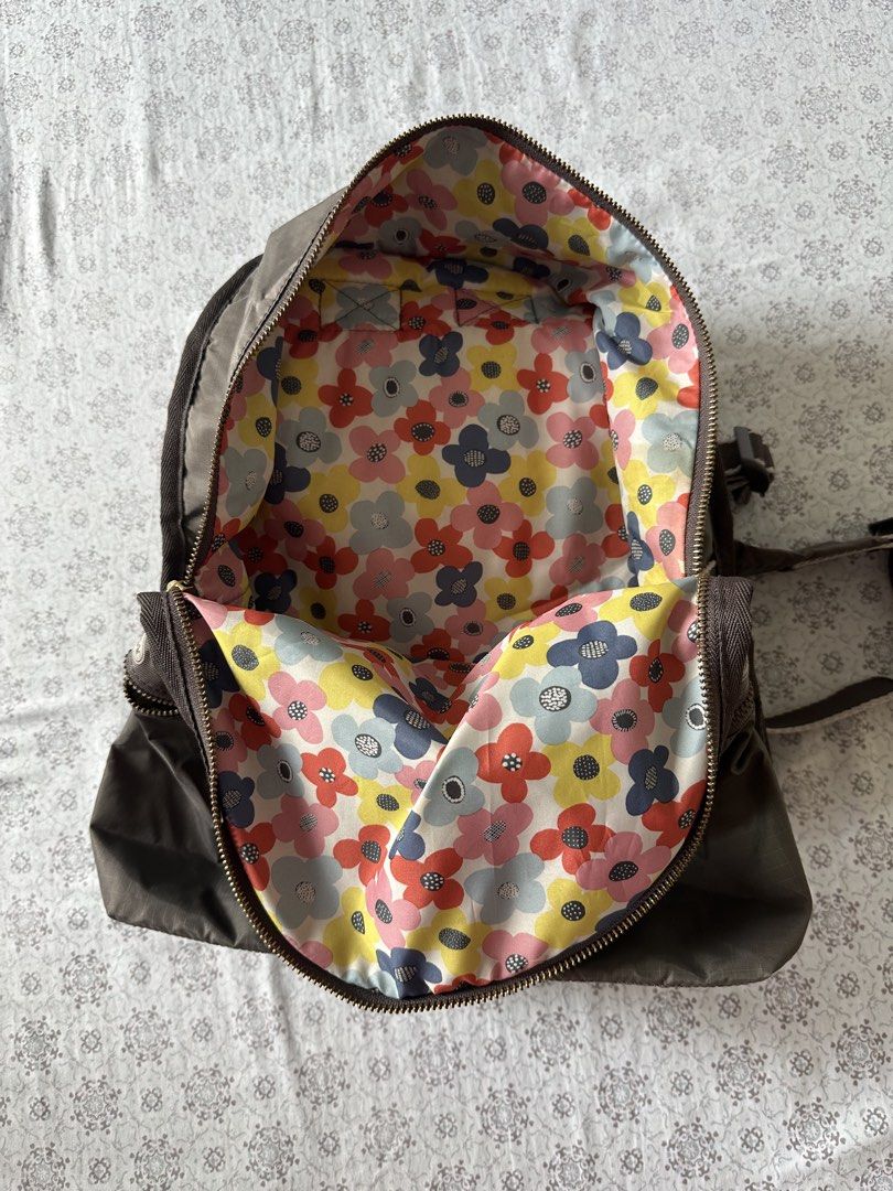 LeSportsac Backpack - Brown with Floral Interior (Category: Backpacks) located in Quezon City. Submitted by 4k_cam (Listing ID 1460961673, Image 2). Description: - Classic LeSportsac backpack in neutral brown. - Fun, colorful floral print interior lining. - Smooth working zippers. - Adjustable straps for comfort. - Ideal for everyday use or travel. - Plenty of interior space for essentials..