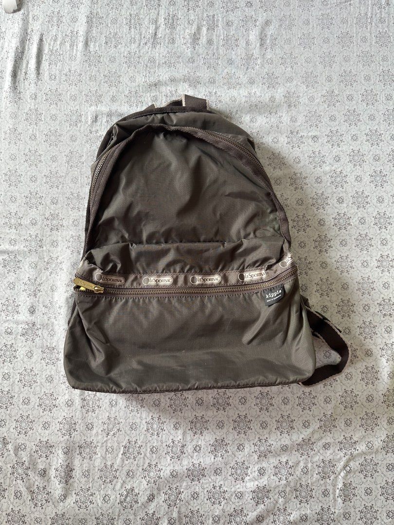 LeSportsac Backpack - Brown with Floral Interior (Category: Backpacks) located in Quezon City. Submitted by 4k_cam (Listing ID 1460961673, Image 1). Description: - Classic LeSportsac backpack in neutral brown. - Fun, colorful floral print interior lining. - Smooth working zippers. - Adjustable straps for comfort. - Ideal for everyday use or travel. - Plenty of interior space for essentials..