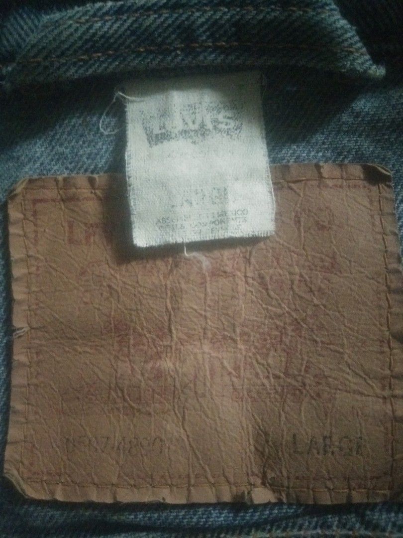 Levis Straus Trucker Denim Jacket (Category: Coats, Jackets and Outerwear) located in Manila. Submitted by chaoticalley (Listing ID 1460959261, Image 1). Description: - Brand: Levi Strauss & Co. - Type: Trucker Denim Jacket - Size: Large (L / EU 52 / UK 42 / US 42) - Features: Classic Two Horse patch, durable denim material - Style: Timeless trucker design - Authenticity: Genuine Levi's product.