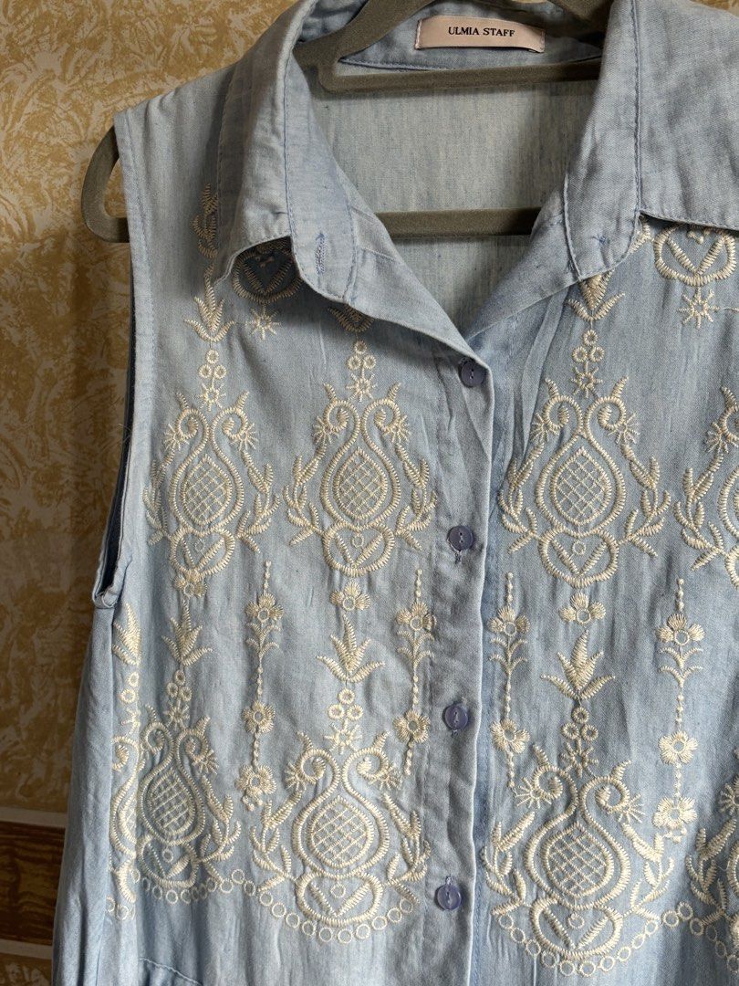 Light Blue Embroidered Sleeveless Button-Up Dress (Category: Dresses) located in Manila. Submitted by glenkm (Listing ID 1460989906, Image 2). Description: - Light blue sleeveless dress - Brand: ULMIA STAFF - Features delicate white embroidery all over - Button-up front for easy wear - Adjustable drawstring waist for a customized fit - Classic collared neckline - Fits up to medium.