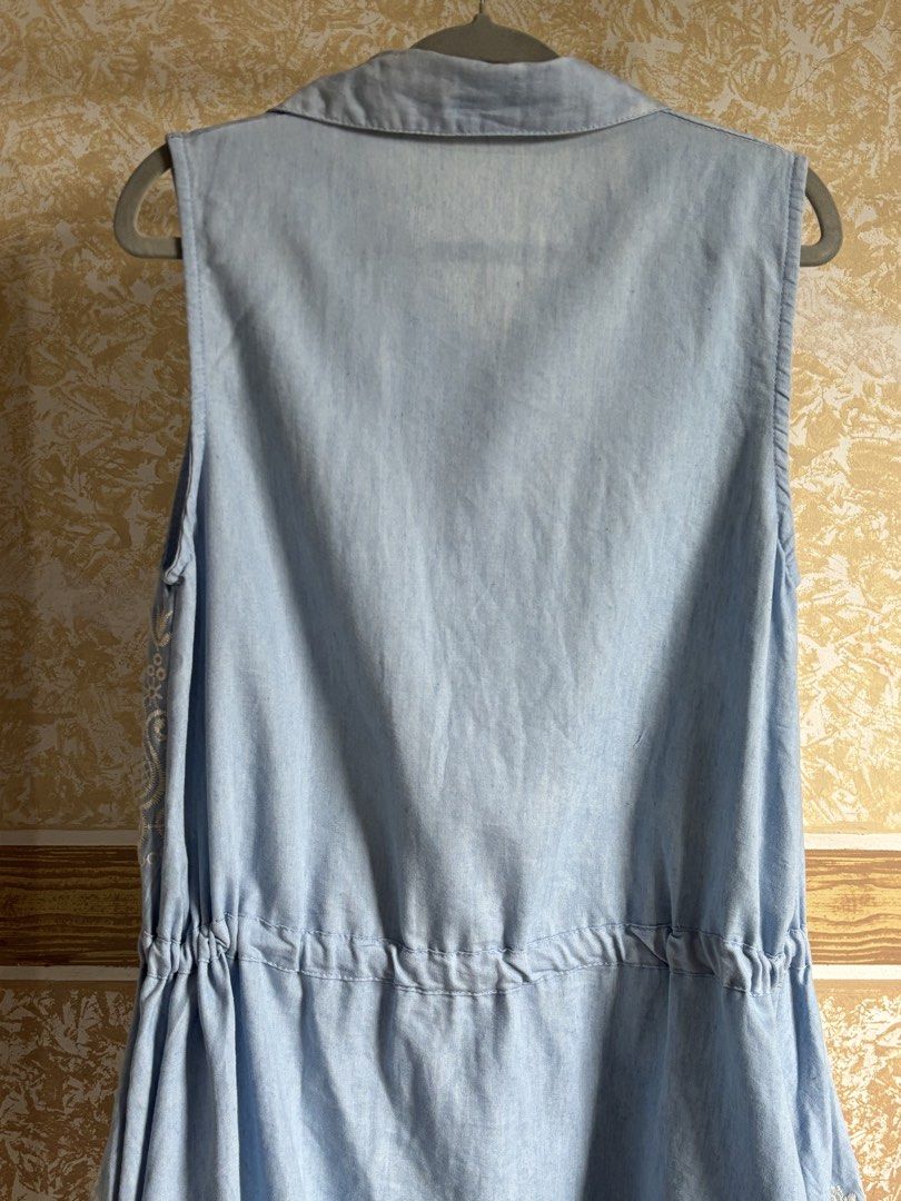 Light Blue Embroidered Sleeveless Button-Up Dress (Category: Dresses) located in Manila. Submitted by glenkm (Listing ID 1460989906, Image 3). Description: - Light blue sleeveless dress - Brand: ULMIA STAFF - Features delicate white embroidery all over - Button-up front for easy wear - Adjustable drawstring waist for a customized fit - Classic collared neckline - Fits up to medium.