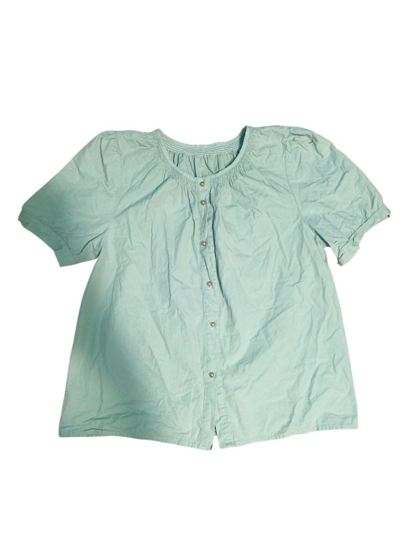 Light Blue Smocked Neck Puff Sleeve Button Up Blouse (Category: Blouses) located in Baguio. Submitted by vyner_hues (Listing ID 1461094556, Image 2). Description: - Cute light blue blouse - Smocked neckline - Button-up front - Short puff sleeves - Comfy and casual style - Great for everyday wear - Easy to pair with jeans or skirts.