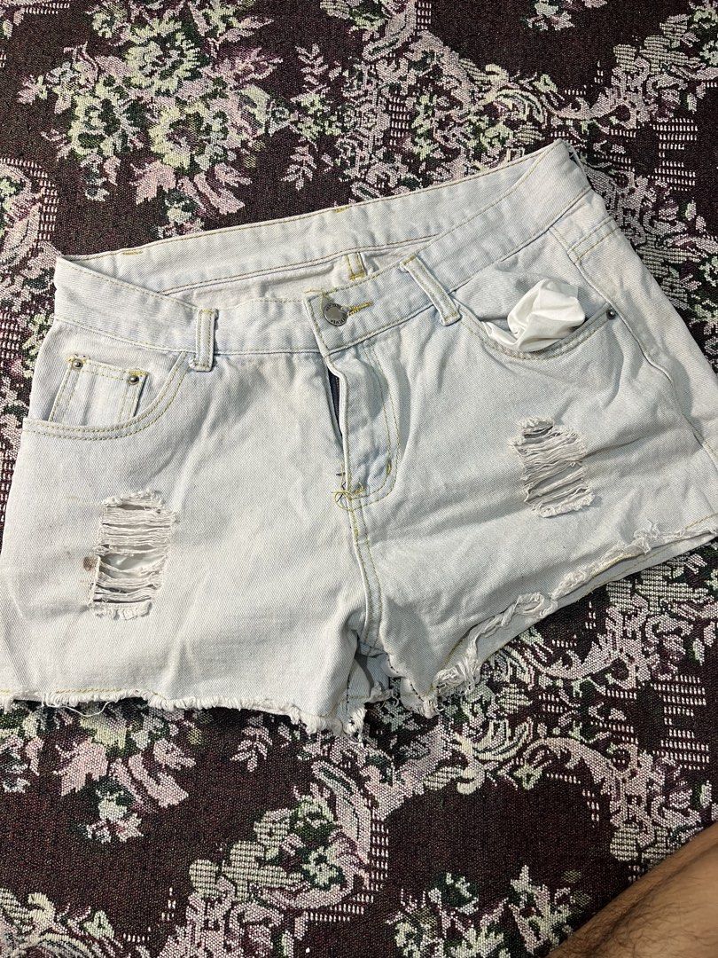 Light Wash Ripped Denim Shorts (Category: Shorts) located in Manila. Submitted by sennisen (Listing ID 1461087740, Image 1). Description: - Light wash denim shorts - Distressed rips on front - Frayed hem for a casual look - Button and zip closure - Two front pockets and two back pockets - Ideal for a laid-back style.