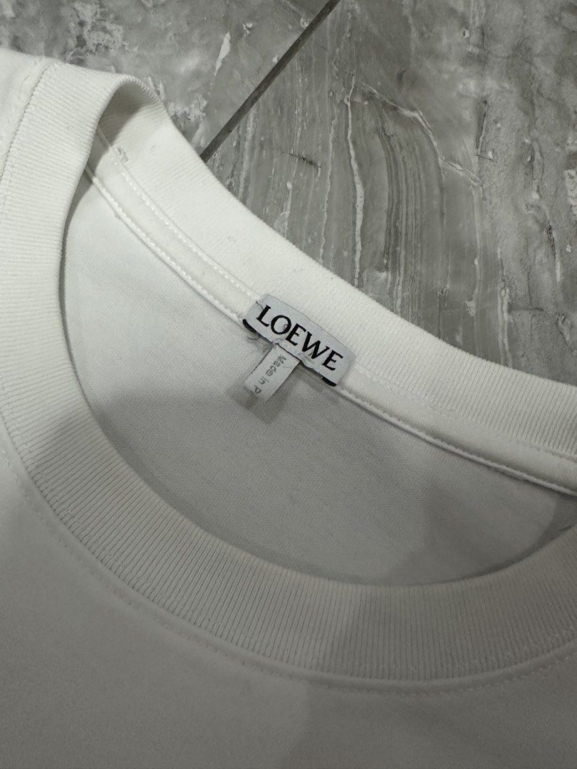 LOEWE ANAGRAM FAKE POCKET TEE (Category: Luxury Apparel) located in Manila. Submitted by 2ndstitch (Listing ID 1461004226, Image 3). Description: LOEWE Anagram Fake Pocket T-shirt White/Blue Issue/s: NONE ( need wash only ) Size: Medium ( Large Fit ) Dimes: 22x28 Overall condition: 9.5/10.