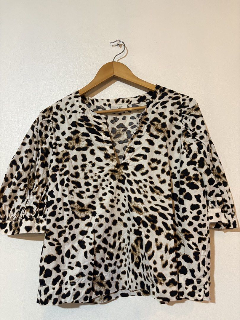 Loft by Ann Taylor Leopard print blouse (Category: Blouses) located in Pasig City. Submitted by teep_mnl (Listing ID 1460950021, Image 1). Description: This is a loose fit blouse with cut details from the colar to the puff sleeves and cropped cut. Measurement Shoulder: 14.5” Chest: 21” Length: 22.5” This was a pasalubong from the States but never got to wear it. No tags. .