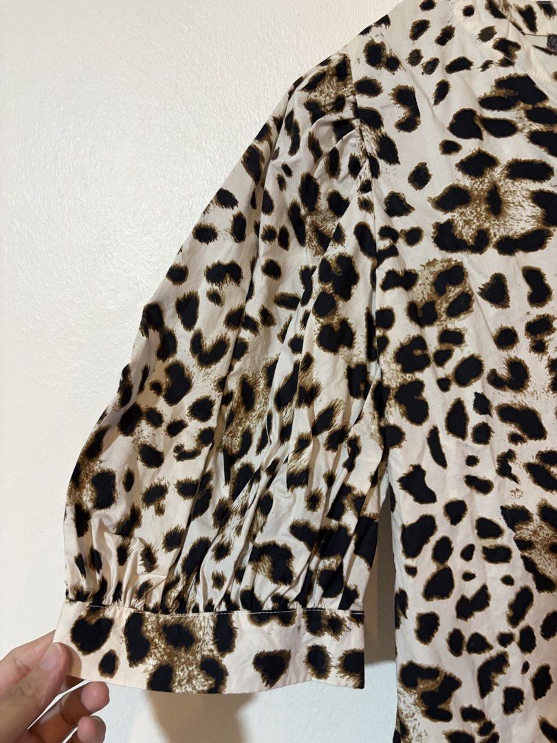 Loft by Ann Taylor Leopard print blouse (Category: Blouses) located in Pasig City. Submitted by teep_mnl (Listing ID 1460950021, Image 2). Description: This is a loose fit blouse with cut details from the colar to the puff sleeves and cropped cut. Measurement Shoulder: 14.5” Chest: 21” Length: 22.5” This was a pasalubong from the States but never got to wear it. No tags. .