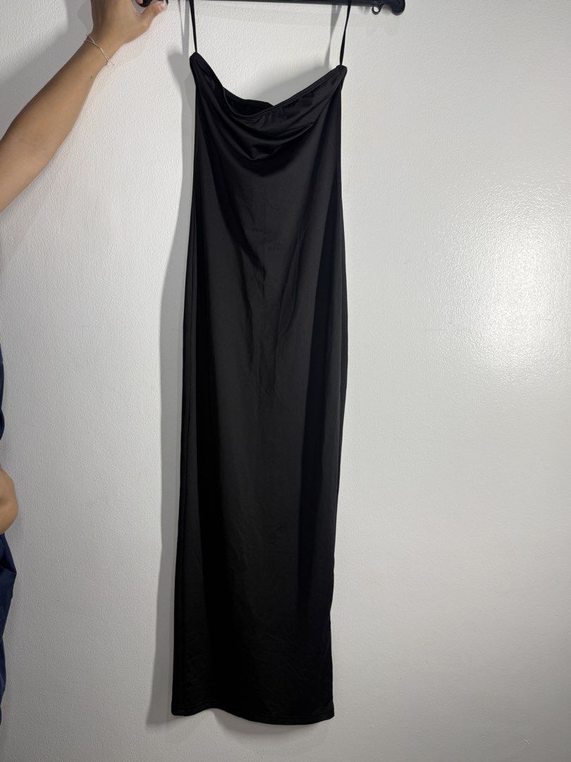 Long Black Strapless Maxi elegant Dress with Slit (Category: Dresses) located in Angeles City. Submitted by lesmiz24601 (Listing ID 1460972557, Image 2). Description: - Long black strapless maxi dress - Slit at the bottom for easy movement - Simple and sleek design - Versatile: dress up or down - Thin spaghetti straps - Material has a slight sheen.
