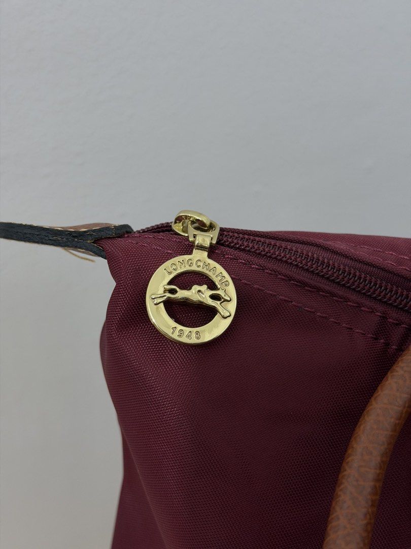 Longchamp Le Pliage Burgundy (Category: Tote Bags) located in Quezon City. Submitted by h.eart (Listing ID 1461063562, Image 2). Description: Condition: 9/10 Barely used Size: Med Mall pullout Actual photos and last price posted .