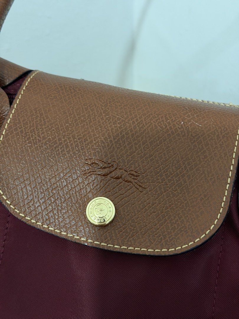 Longchamp Le Pliage Burgundy (Category: Tote Bags) located in Quezon City. Submitted by h.eart (Listing ID 1461063562, Image 3). Description: Condition: 9/10 Barely used Size: Med Mall pullout Actual photos and last price posted .