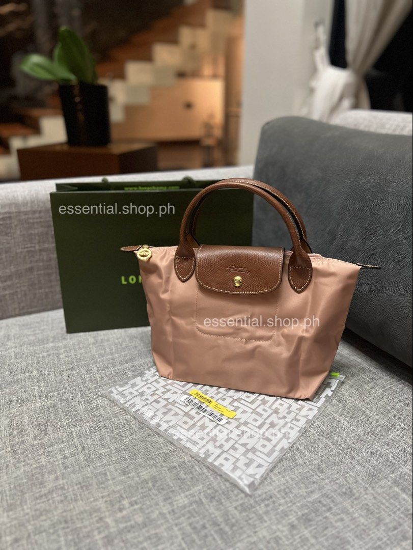 Longchamp Le Pliage Original Small Short Handle Bag Pink Tea (Category: Luxury Bags & Wallets) located in Manila. Submitted by essential.shop.ph (Listing ID 1461043396, Image 1). Description: PREORDER. 7-10 days ETA. ☺️ Longchamp Le Pliage Original Small Short Handle Pink Tea ***Actual color difficult to capture. Changes due to lighting. Includes care card, LGP zip lock pouch and paper bag. Dimensions 9.1 inches (L - measured at the base of the b