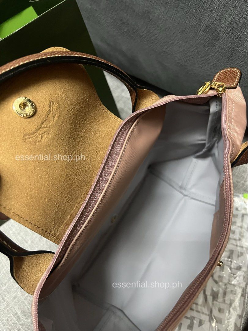 Longchamp Le Pliage Original Small Short Handle Bag Pink Tea (Category: Luxury Bags & Wallets) located in Manila. Submitted by essential.shop.ph (Listing ID 1461043396, Image 3). Description: PREORDER. 7-10 days ETA. ☺️ Longchamp Le Pliage Original Small Short Handle Pink Tea ***Actual color difficult to capture. Changes due to lighting. Includes care card, LGP zip lock pouch and paper bag. Dimensions 9.1 inches (L - measured at the base of the b