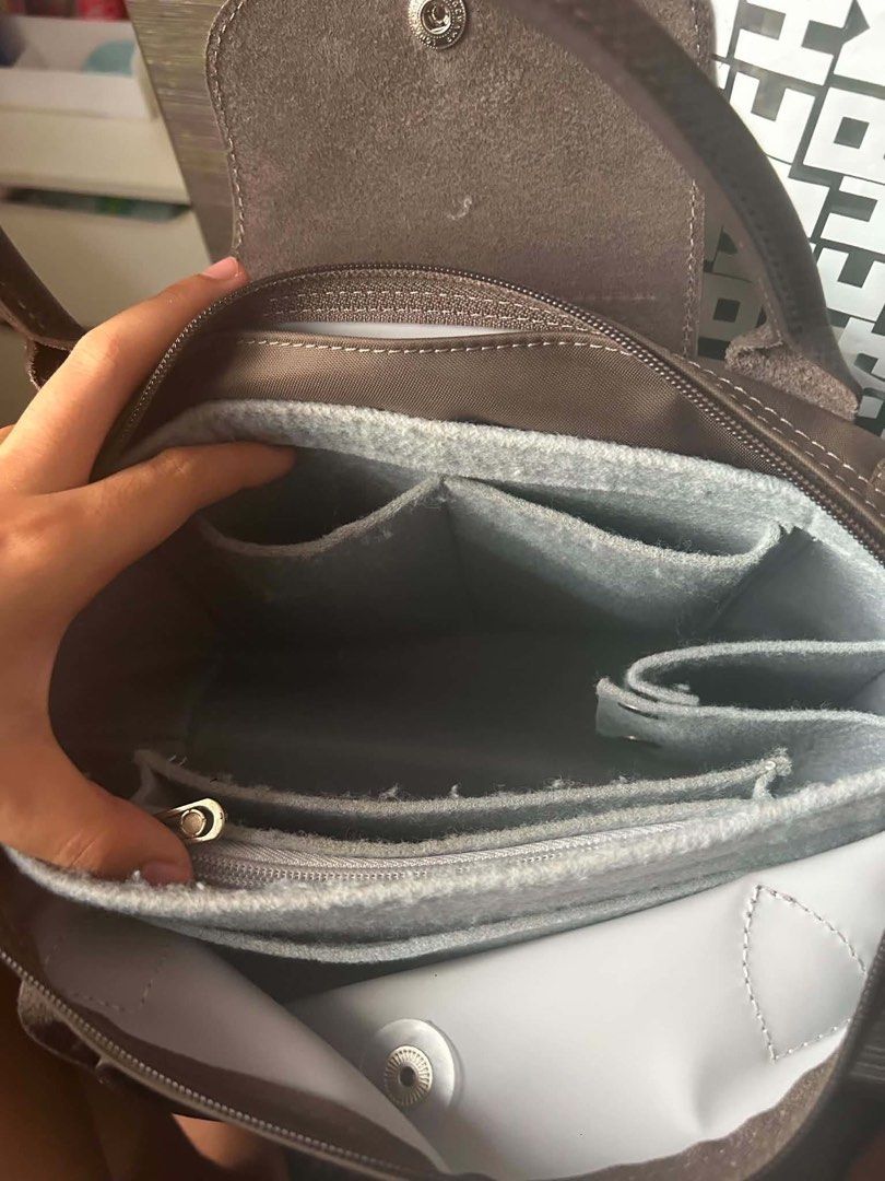 Longchamp Le Pliage Top Handle Bag (Category: Luxury Bags & Wallets) located in Marikina City. Submitted by cristinelinghon12 (Listing ID 1460996729, Image 2). Description: - Brand: Longchamp - Model: Le Pliage - Color: Brown - Size: Small - Condition: Good - Includes: Pink pouch and keychain - Ideal for: Everyday use WITH RECEIPT.