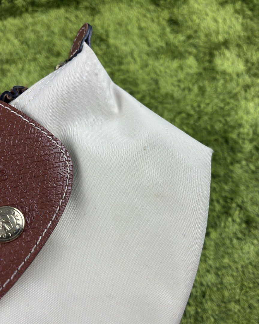 Longchamp Mini Le Pliage Mini Bag (Category: Purses & Pouches) located in Lucena. Submitted by shopdotmane (Listing ID 1461074485, Image 2). Description: Longchamp Mini Le Pliage Mini Bag Still in good condition Needs light cleaning inside & out Missing sling .