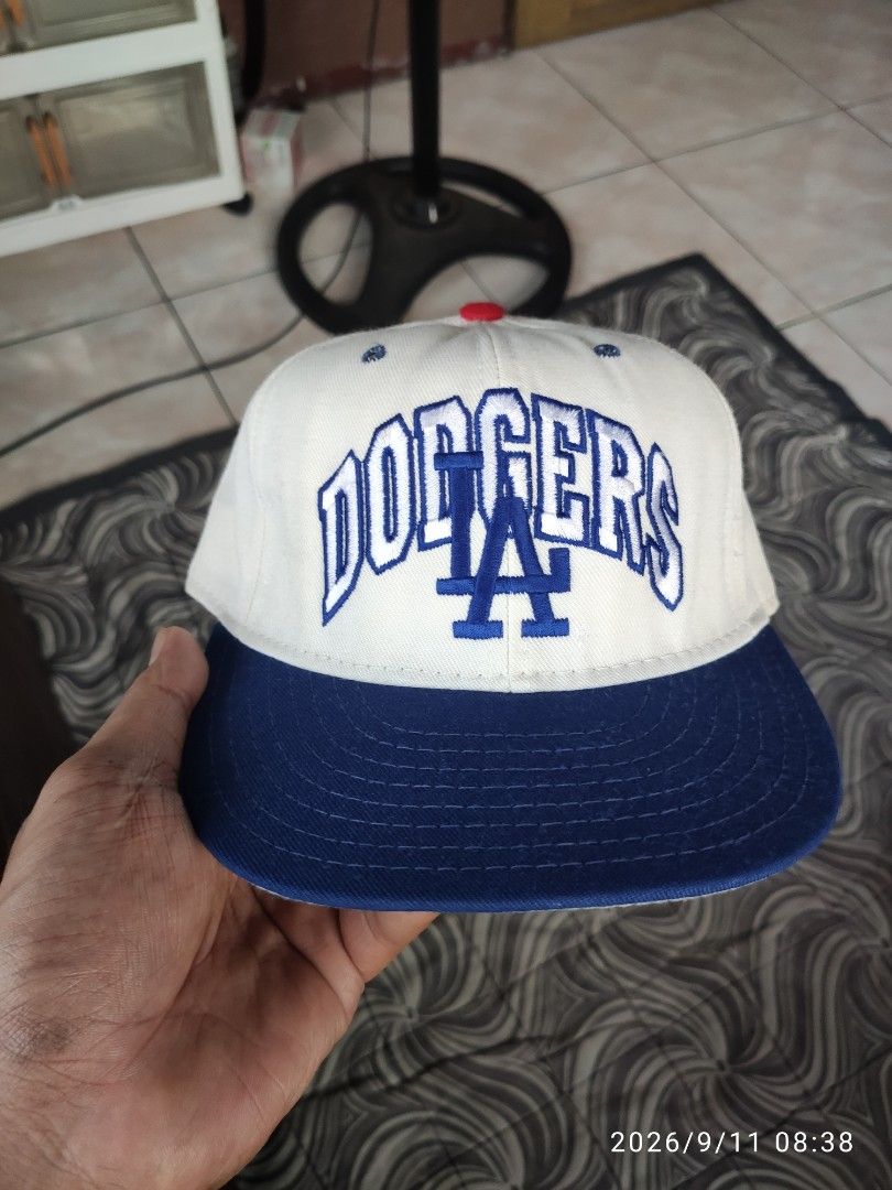 Los Angeles Dodgers Pro-Line Baseball Cap (Category: Caps & Hats) located in Las Pinas. Submitted by vtg_sakalam2021 (Listing ID 1460955839, Image 1). Description: - Classic white and blue Los Angeles Dodgers cap - Features embroidered 'Dodgers' logo on the front - Smaller embroidered logo on the side - Pro-Line tag inside - fitted hat 7 1/8 - Ideal for any Dodgers fan.