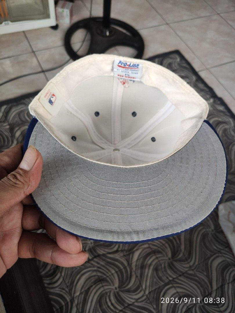 Los Angeles Dodgers Pro-Line Baseball Cap (Category: Caps & Hats) located in Las Pinas. Submitted by vtg_sakalam2021 (Listing ID 1460955839, Image 3). Description: - Classic white and blue Los Angeles Dodgers cap - Features embroidered 'Dodgers' logo on the front - Smaller embroidered logo on the side - Pro-Line tag inside - fitted hat 7 1/8 - Ideal for any Dodgers fan.
