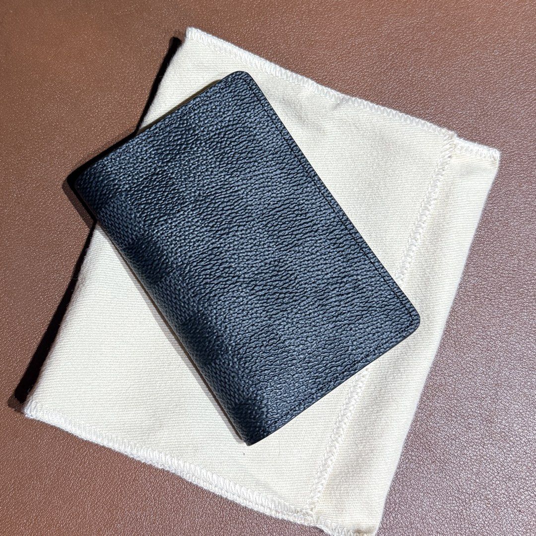 Louis Vuitton Damier Graphite Pocket Organizer (Category: Luxury Bags & Wallets) located in Quezon City. Submitted by endofdayzs (Listing ID 1461069478, Image 1). Description: - Authentic Louis Vuitton Pocket Organizer - Damier Graphite Canvas - Made in Spain - Multiple Card Slots for Organization - Comes with Dust Bag and Box 2026 SRP 26,200.00 Full specs here https://ph.louisvuitton.com/eng-ph/products/pocket-organizer-damier-graphite-canvas-00
