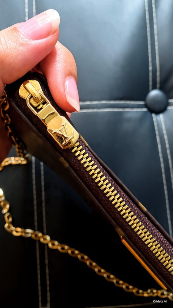 Louis Vuitton Monogram Pouch with Chain (Category: Luxury Bags & Wallets) located in Baguio. Submitted by elianaam. (Listing ID 1460923112, Image 3). Description: - Authentic Louis Vuitton pouch bag - Classic monogram canvas - Orange leather trim - Gold chain strap included - Zipper closure - Made in France - Date code: SP8159 - Ideal for carrying essentials.
