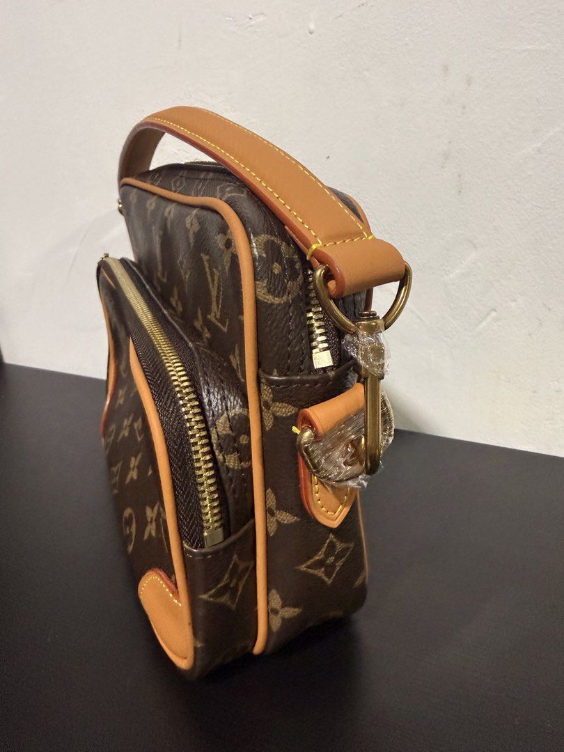 Louis Vuitton Nils Crossbody Bag microchipped (Category: Luxury Bags & Wallets) located in Muntinlupa City. Submitted by decluttering.era.alabang (Listing ID 1461037583, Image 3). Description: - Classic Louis Vuitton monogram canvas crossbody bag - Features two zippered compartments for organization - Genuine leather trim and strap - Elegant gold-tone hardware - Versatile for everyday use, ideal for essentials - Includes a detachable strap.