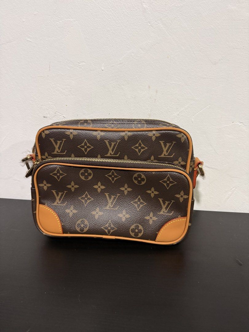 Louis Vuitton Nils Crossbody Bag microchipped (Category: Luxury Bags & Wallets) located in Muntinlupa City. Submitted by decluttering.era.alabang (Listing ID 1461037583, Image 1). Description: - Classic Louis Vuitton monogram canvas crossbody bag - Features two zippered compartments for organization - Genuine leather trim and strap - Elegant gold-tone hardware - Versatile for everyday use, ideal for essentials - Includes a detachable strap.