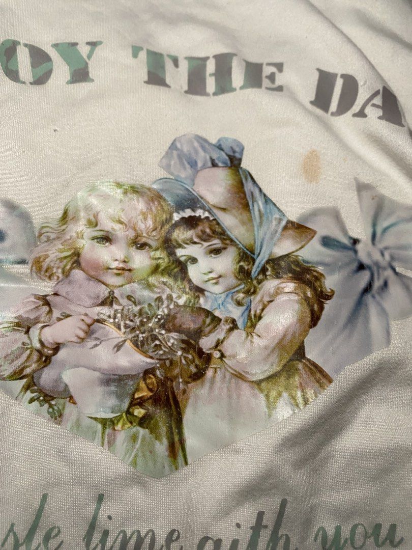 Lovito White Graphic T-shirt with Drawstring Sides (Category: Shirts) located in San Jose del Monte. Submitted by skyarraa (Listing ID 1460928133, Image 2). Description: Has issue stain and change color in print.