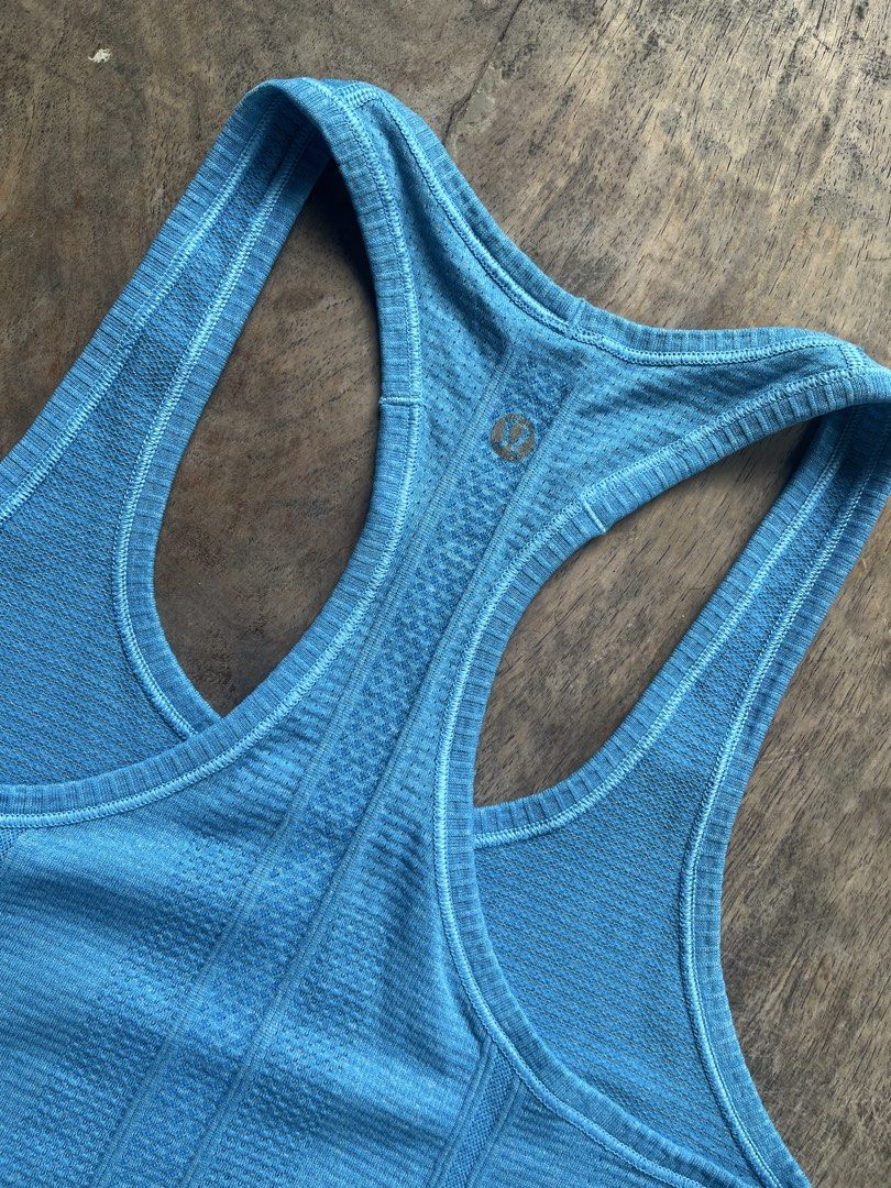 Lululemon Blue Racerback Tank Top (Category: Activewear) located in Siniloan. Submitted by marceiron316276 (Listing ID 1460979529, Image 3). Description: - Blue Lululemon tank top - Racerback style for comfort - Breathable fabric - Ideal for running and gym workouts - Minimalist design with subtle texture - Features Lululemon logo on the back.