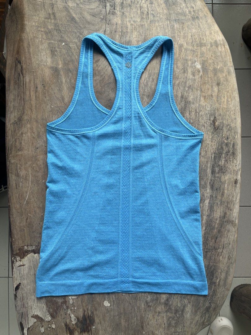 Lululemon Blue Racerback Tank Top (Category: Activewear) located in Siniloan. Submitted by marceiron316276 (Listing ID 1460979529, Image 2). Description: - Blue Lululemon tank top - Racerback style for comfort - Breathable fabric - Ideal for running and gym workouts - Minimalist design with subtle texture - Features Lululemon logo on the back.