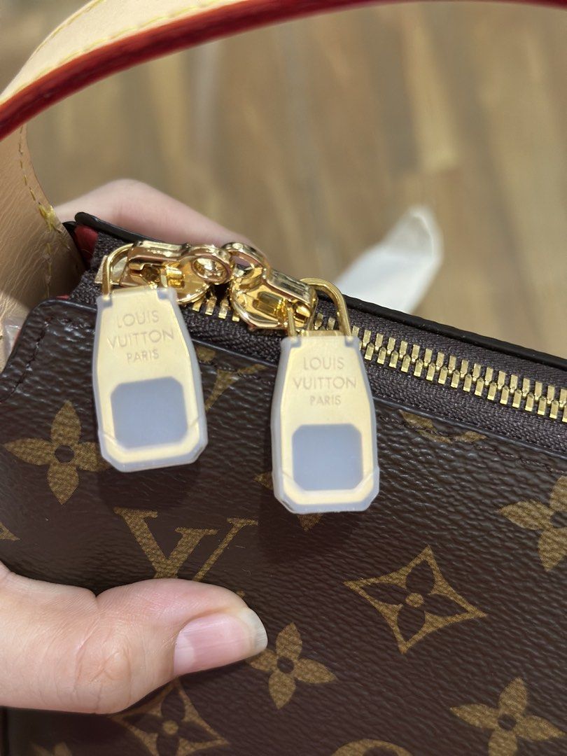 LV Slouchy hand bag (Category: Shoulder Bags) located in Manila. Submitted by kae_mgg (Listing ID 1461111708, Image 3). Description: - Classic brown monogram canvas - Vachetta leather trim - Gold hardware and zipper closure - Red interior - Made in France - Ideal for carrying everyday essentials.