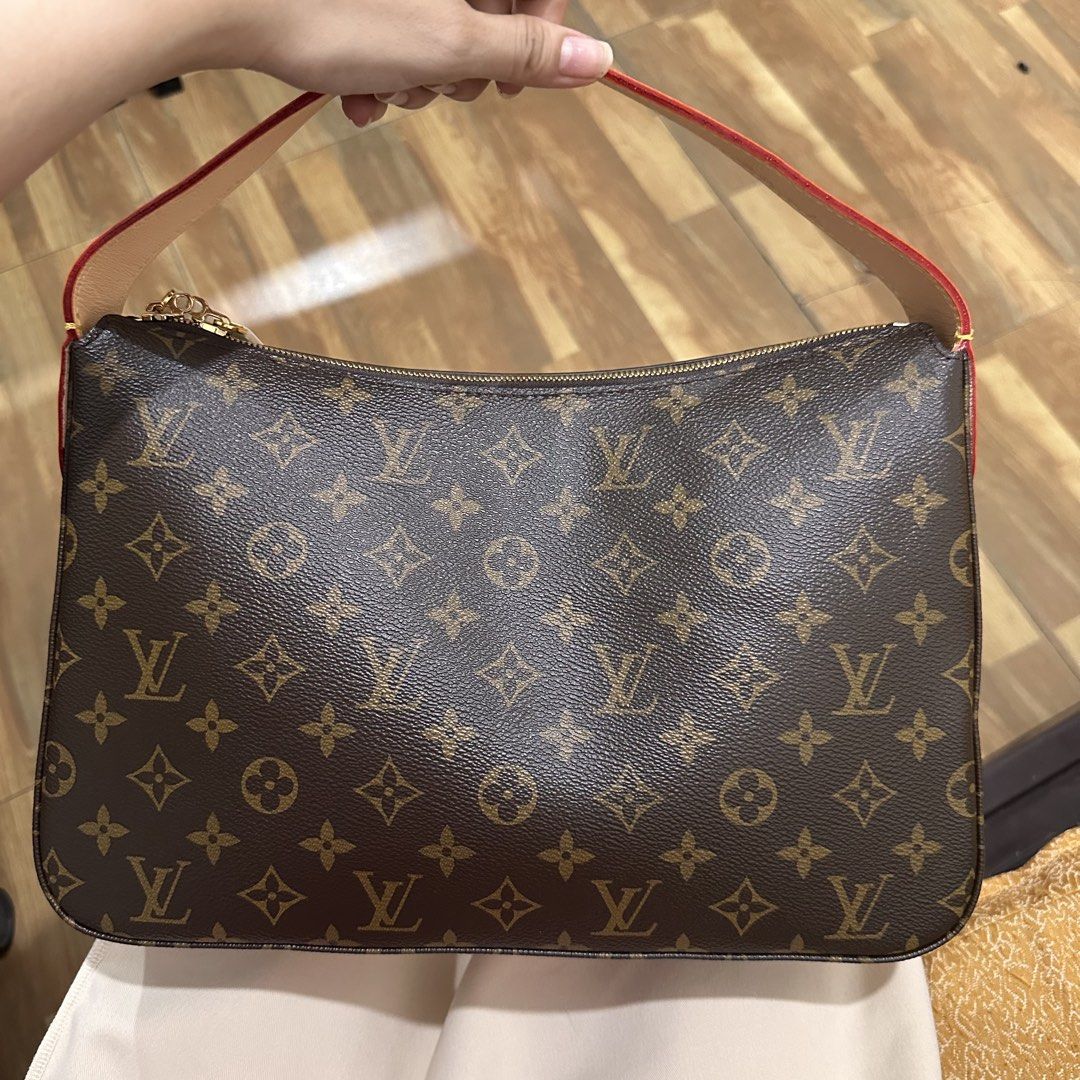 LV Slouchy hand bag (Category: Shoulder Bags) located in Manila. Submitted by kae_mgg (Listing ID 1461111708, Image 2). Description: - Classic brown monogram canvas - Vachetta leather trim - Gold hardware and zipper closure - Red interior - Made in France - Ideal for carrying everyday essentials.