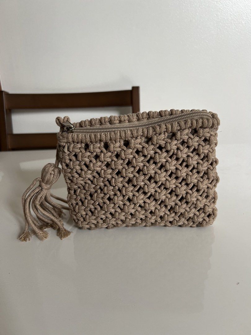 Macrame Tassel Pouch Bag (Category: Purses & Pouches) located in Quezon City. Submitted by jjdoubletake (Listing ID 1460997810, Image 1). Description: - Cute macrame pouch with a handmade look. - Neutral beige color. - Zipper closure for secure storage. - Features a stylish tassel detail. - Ideal for organizing small essentials..
