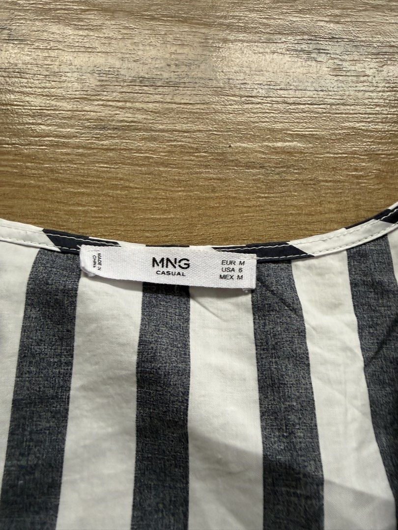 Mango Stripe Blouse (Category: Dresses) located in Tagaytay City. Submitted by prelovedbytmj (Listing ID 1460985048, Image 2). Description: Mango Stripe Blouse. Color Navy Blue combination of white. Size Medium. Good condition. Kasya din po sa Small.