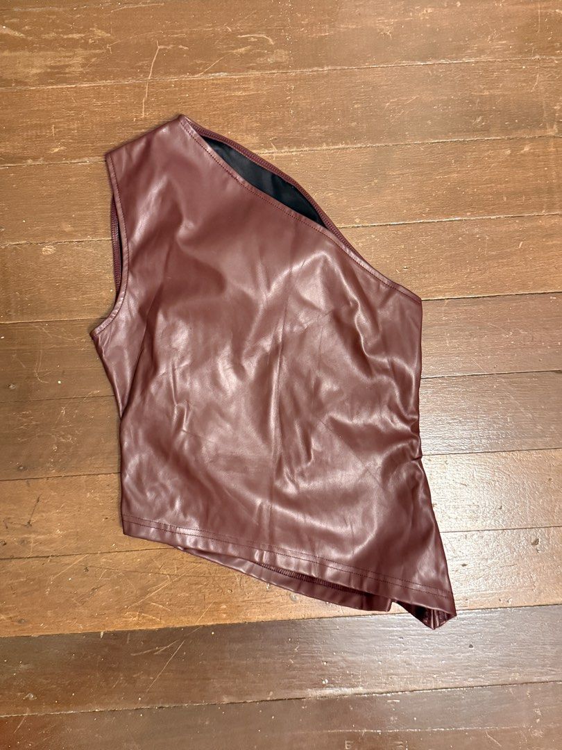 Maroon Faux Leather One Shoulder Ruched Top (Category: Sleeveless) located in Angeles City. Submitted by lesmiz24601 (Listing ID 1460976144, Image 2). Description: - Chic maroon one-shoulder top - Made with faux leather material - Features stylish side ruching detail - Perfect for dressing up or down - Ideal for a night out.