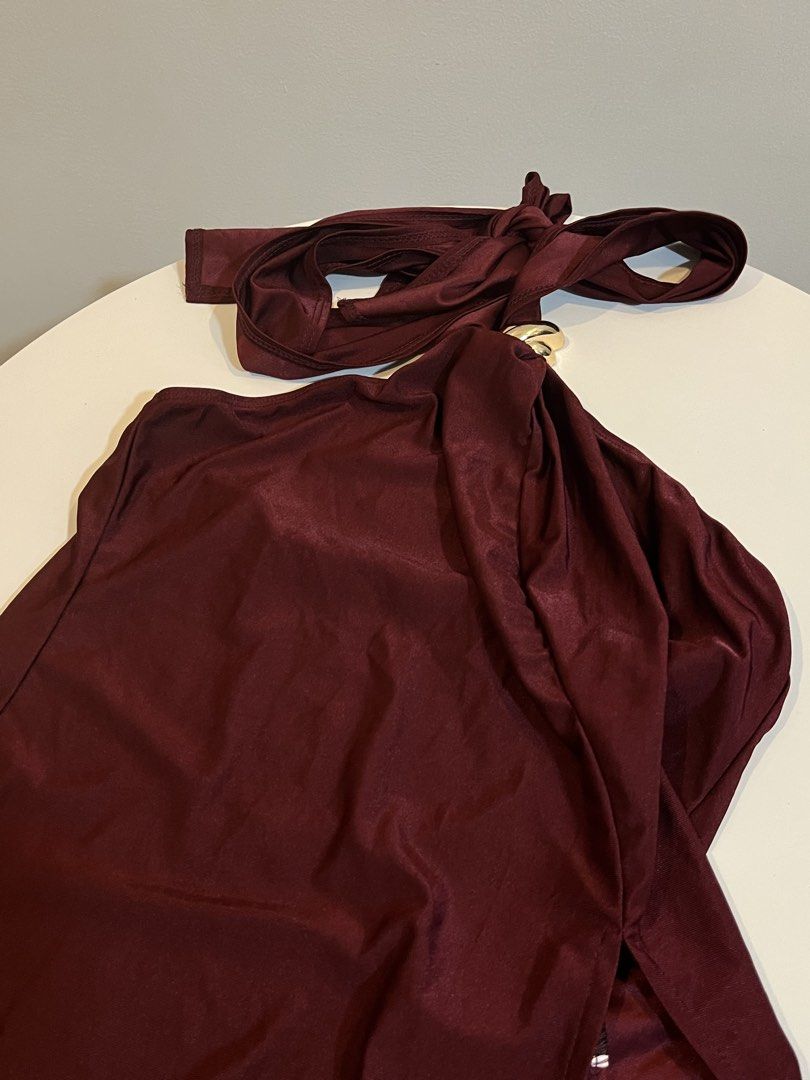 Maroon Halter Top with Gold Ring Detail (Category: Sleeveless) located in Manila. Submitted by xoshushi.dcltr (Listing ID 1460973885, Image 3). Description: - Chic maroon halter top - Features a stylish gold ring detail at the front - Secure tie-up closure at the neck - Fabric has a subtle, elegant sheen - Estimated size: Small (S) - Ideal for evening events, parties, or a night out.