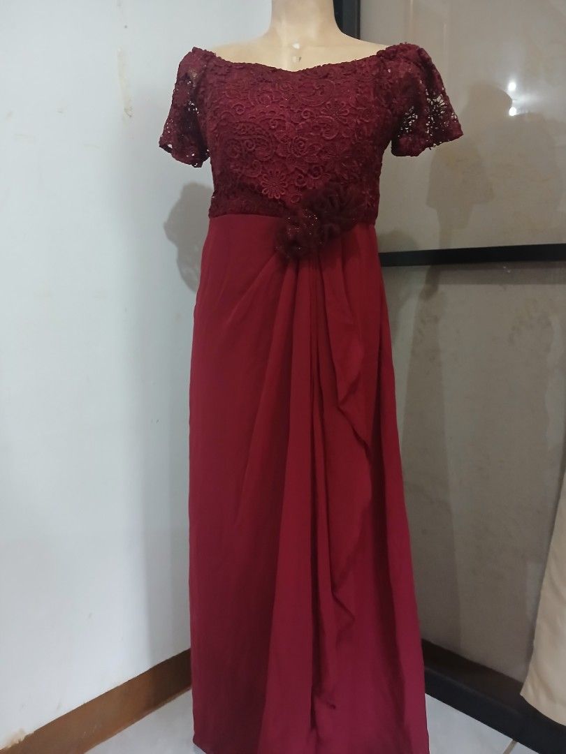 Maroon Lace Overlay Evening Gown (Category: Evening dresses & gowns) located in Abucay. Submitted by mimasshop (Listing ID 1461114748, Image 3). Description: - Beautiful maroon evening gown - Delicate lace overlay on bodice and sleeves - Flattering draped skirt - Floral embellishment at the waist - Ideal for formal events and weddings - Comfortable and chic design.