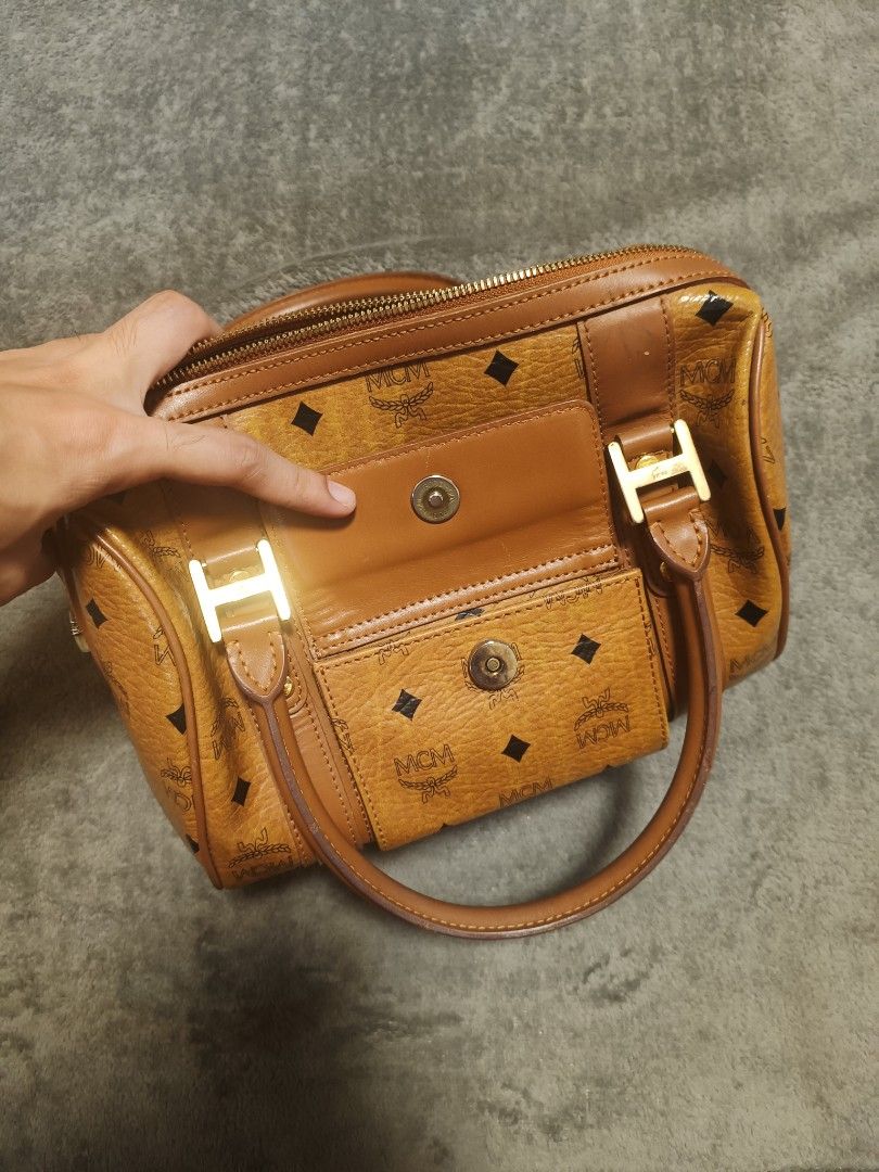 MCM (Category: Purses & Pouches) located in Cavite. Submitted by south.loot (Listing ID 1460385937, Image 3). Description: MCM Visetos Boston Handbag Visetos Monogram Canvas Dual top handles Front flap pocket Gold-tone hardware Spacious interior.