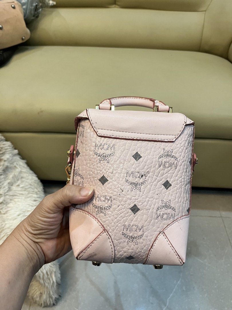 MCM mini bagpack-pink (Category: Luxury Bags & Wallets) located in Cebu City. Submitted by nbetcuban007trendyfinds (Listing ID 1460929553, Image 3). Description: Genuine MCM visetos MCM shoulder bag in good overall condition. Color: Pink. With issues in sling strap rubber lining Like new except the strap .