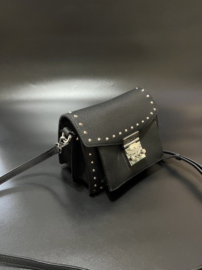 MCM Patria Studded Crossbody (Category: Luxury Bags & Wallets) located in Cebu City. Submitted by sexyclosetph2.0 (Listing ID 1460922553, Image 2). Description: In great condition Ykk zip, with etiketa and turnable screws Made in Italy Very nice in actual po No issues signs of normal wear Clean inside and outside Suede yung inside Many compartment Genuine leather .