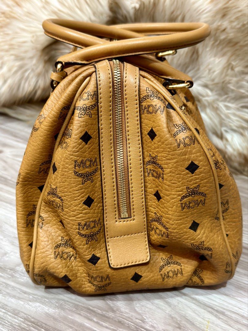 MCM Visetos Cognac Boston Bag (Category: Shoulder Bags) located in Navotas City. Submitted by jobelle.maligaya (Listing ID 1461094185, Image 3). Description: MCM Visetos Cognac Boston Bag Like New Condition! 9.5/10 No issues No oxidation, No pipe issues, Intact rubber linings. .