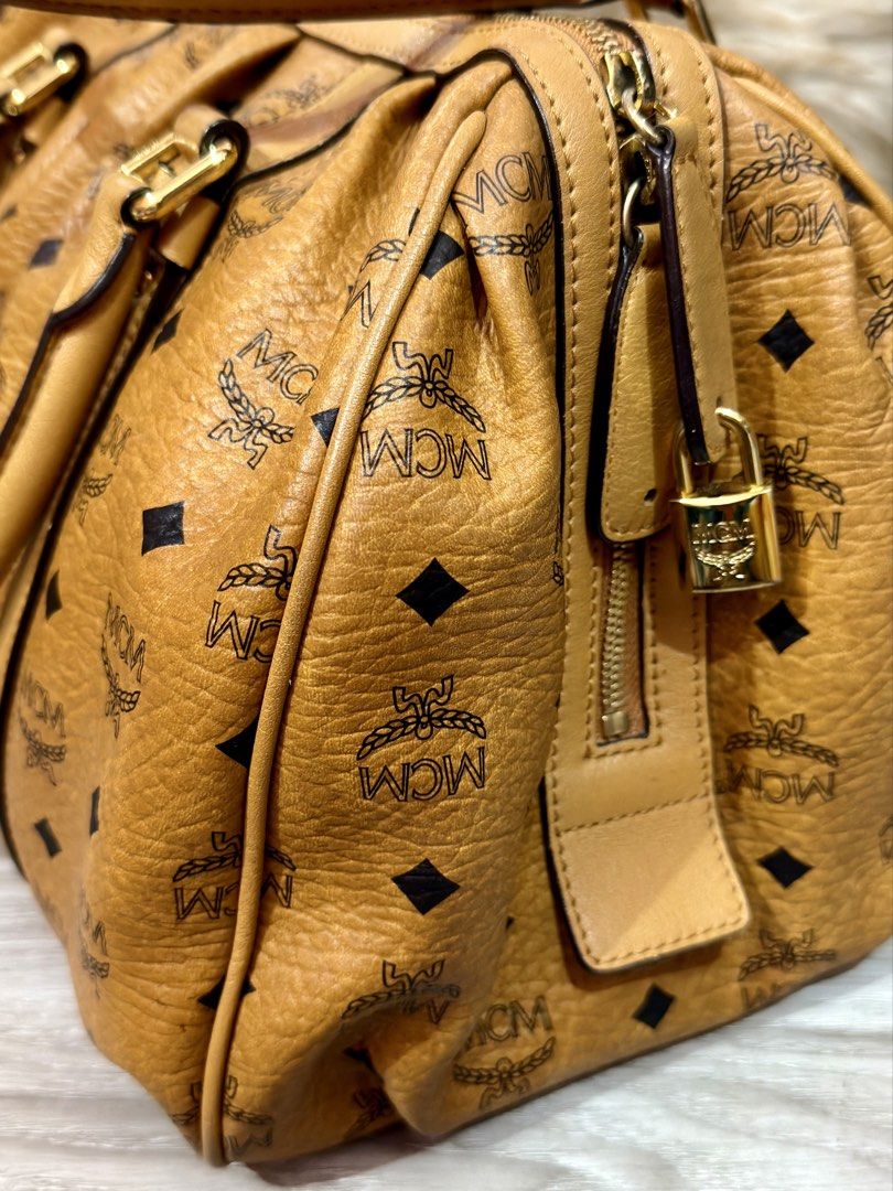 MCM Visetos Cognac Boston Bag (Category: Shoulder Bags) located in Navotas City. Submitted by jobelle.maligaya (Listing ID 1461094185, Image 2). Description: MCM Visetos Cognac Boston Bag Like New Condition! 9.5/10 No issues No oxidation, No pipe issues, Intact rubber linings. .