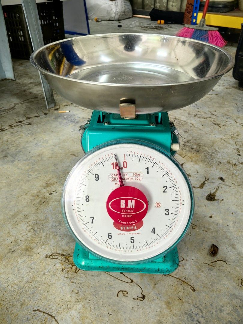 Mechanical Scale Two Dial (Category: Others) located in Kuala Lumpur. Submitted by warmbird_097f5e (Listing ID 1460955607, Image 2). Description: - Sturdy mechanical scale - Teal green body - Stainless steel weighing bowl - Double dial for easy reading - 10kg capacity - Suitable for kitchen or small business use.