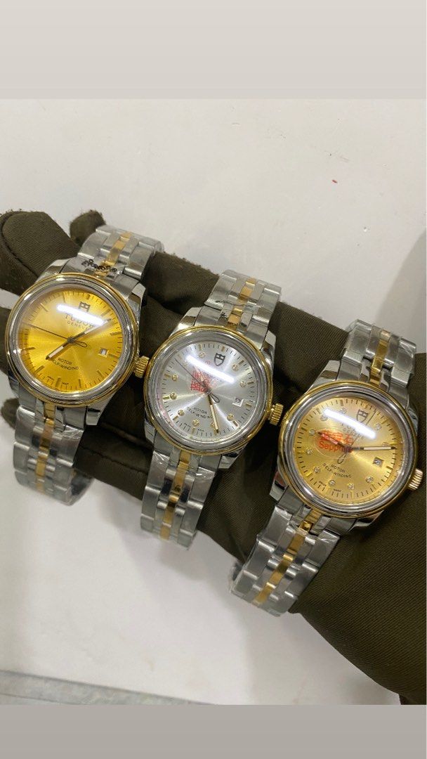 Men watches (Category: Luxury Watches) located in San Juan City. Submitted by wristcheckdiaries (Listing ID 1460970061, Image 1). Description: - Three Geneve Rotor Self-Winding Watches - Two models with Gold Dials, Diamond Markers, and Gold Bracelet Accents - One model with Silver Dial and Gold Bracelet Accents - All feature durable Sapphire Crystal - Authentic Swiss Made quality - Ideal for watch collectors or daily luxury wear.