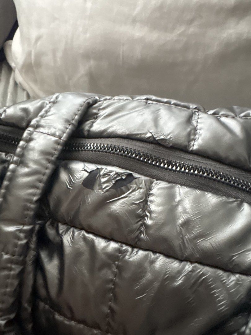 Metallic Silver Puffer Tote Bag (Category: Shoulder Bags) located in Manila. Submitted by violoot (Listing ID 1460989626, Image 3). Description: Sleek, statement-making, and effortlessly chic. Featuring a plush quilted design in a luminous metallic silver finish—perfect for adding a modern touch to any look. .