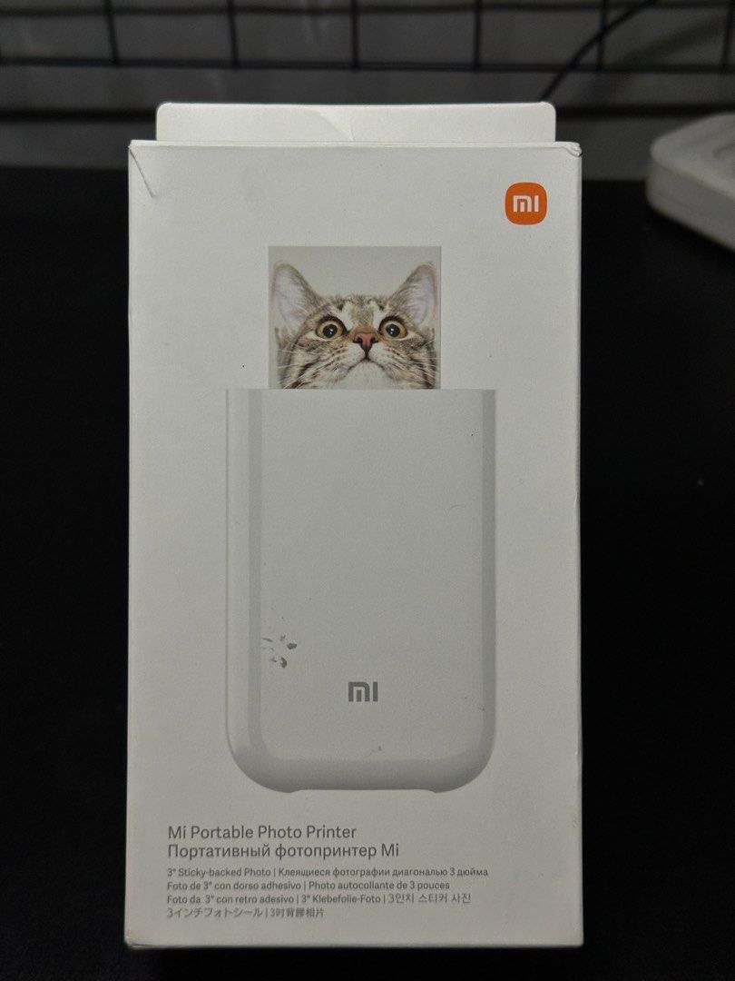 Mi Portable Photo Printer (Category: Printers, Scanners & Copiers) located in Manila. Submitted by markjandell (Listing ID 1461050269, Image 1). Description: Mi Portable Photo Printer • Print Tech: Thermal Zink ( Zero Ink ) • Printing Resolution: 313 x 400 • Photo Size: 2 x 3 in / 50 x 76 mm • Connectivity: Bluetooth 5.0 • Battery: 500mAh ( Can print up to 20 photos ) • App Compatibility: Xiaomi Home App Condition: 8/10 with sticker residues and 