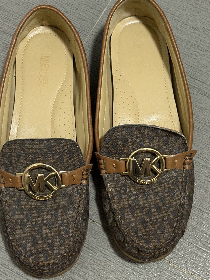 Michael Kors Monogram Loafers (Category: Loafers) located in Pasig City. Submitted by karcart (Listing ID 1461010258, Image 2). Description: - Authentic Michael Kors loafers - Classic MK monogram print in brown and tan - Features gold MK logo hardware on the front strap - Comfortable slip-on style - Versatile for both casual and dressy occasions.
