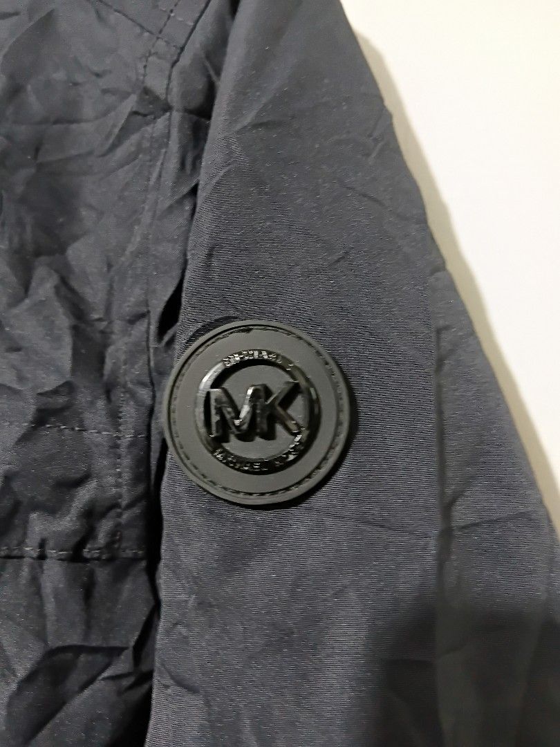 Michael Kors Navy Blue Jacket Size S (Category: Coats, Jackets and Outerwear) located in Valencia. Submitted by cabisaythriftshop (Listing ID 1461080260, Image 2). Description: - Michael Kors jacket - Size: S - Lightweight material, ideal for layering - Zip-up front with convenient pockets - Made in Vietnam - Signature Michael Kors logo detail on the sleeve Michael Kors Jacket Small on tag best fit medium 26L*21W As new .