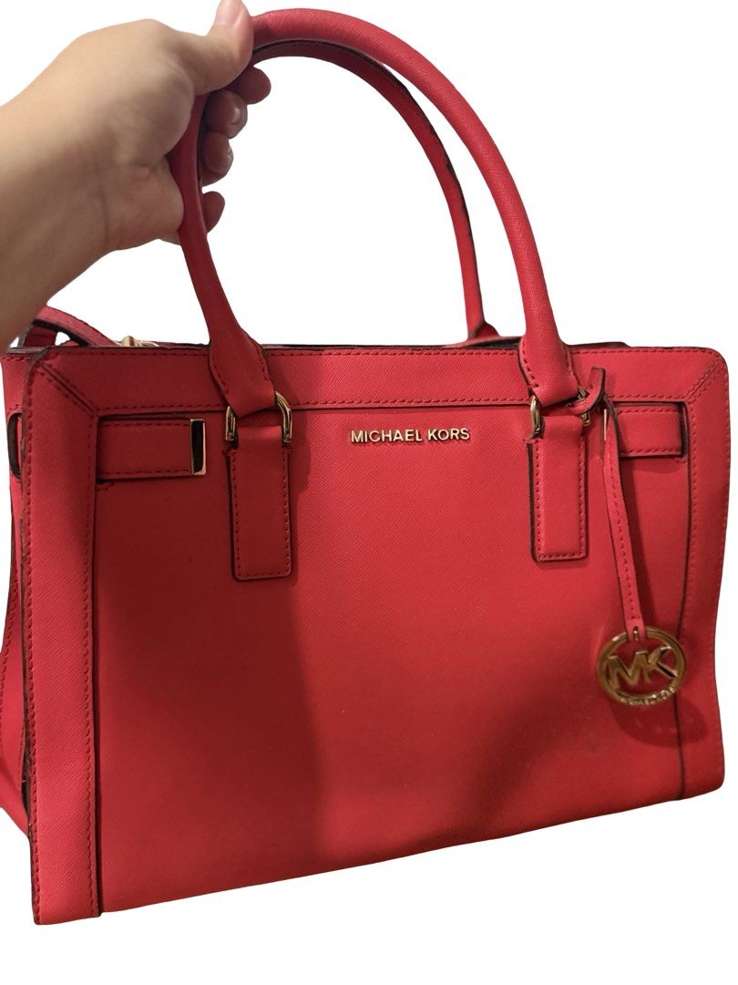 Michael Kors Red Leather Satchel Handbag (Category: Luxury Bags & Wallets) located in Quezon City. Submitted by msmarjqab (Listing ID 1461009650, Image 1). Description: - Authentic Red Michael Kors Satchel - Elegant Gold Hardware Details - Dimensions: 31cm (width) x 21cm (height) - Interior is clean and well-maintained -unnoticeable damages in lining and on surface -no dustbag .
