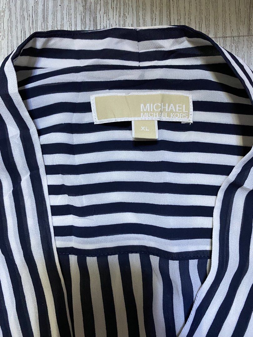 Michael Kors Striped Wrap Blouse (Category: Blouses) located in Pasig City. Submitted by terrencec34805 (Listing ID 1461092752, Image 2). Description: vertically striped draped wrap-front blouse by Michael Kors featuring a stylish crossover V-neckline Excellent condition Size:XL Width:23.5 Length:29.